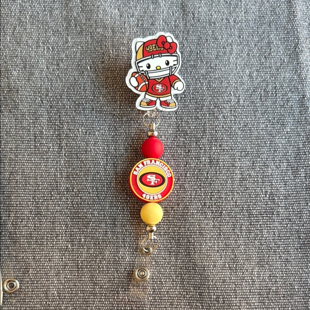Hello Kitty San Francisco 49ers Red and Yellow Badge Reel